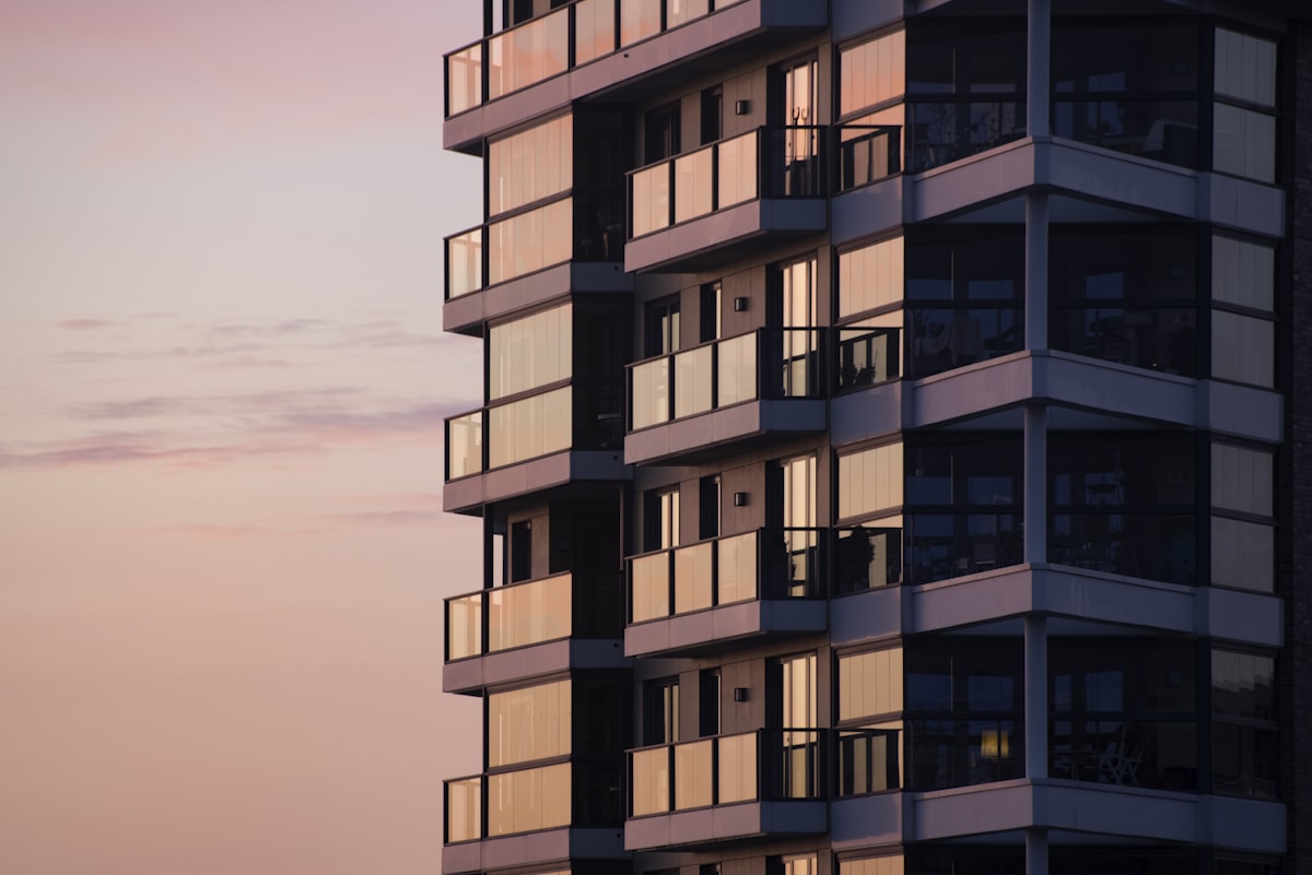 Finished high-rise residential building lit by afternoon sunlight